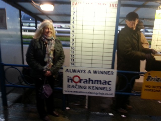 Bemused bookie Brian looks on as Norah secures her pitch!